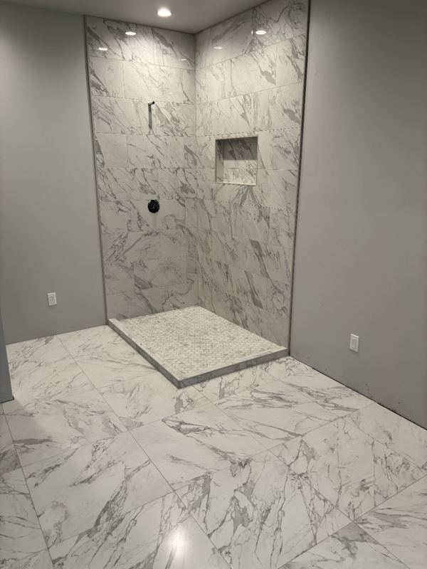 Large format marble-look tile shower