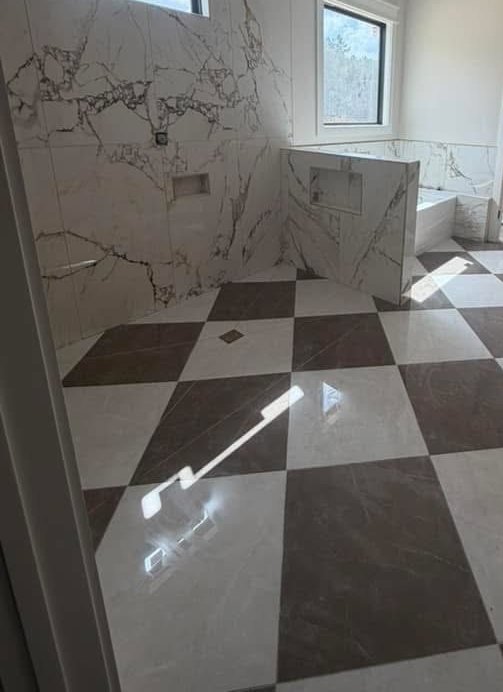 Marble checkerboard floor with full-height slab shower wall
